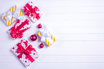 Christmas gifts and christmas decorations on a white wooden background. Top view. Flat lay. Copy space for you text.