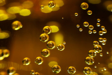 Bubbles in a glass with champagne close-up. Background. Texture
