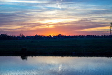 Obraz na płótnie Canvas sunset over canal