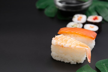 Japanese seafood sushi set on black background isolated, copy space