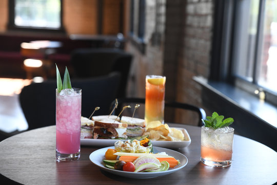 Cocktails and sandwiches with crudites served on table