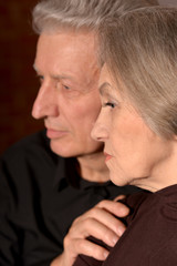 Close up portrait of sad senior couple