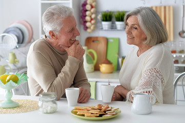 Portrait of cute mature couple drinking tea