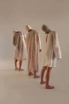 Women in row rotating necks