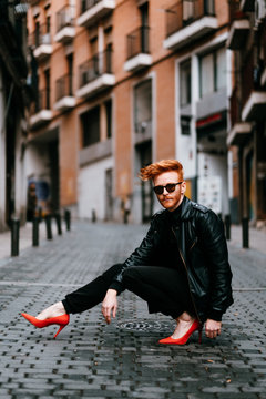 Redhead cool man walking down the street on red high heels Stock Photo |  Adobe Stock