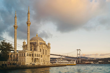 Fototapeta na wymiar Old historical Ortakoy Mosque with long exposure and behind there is bosporus 