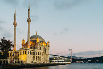 Fototapeta na wymiar Old historical Ortakoy Mosque with long exposure and behind there is bosporus 