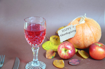 Thanksgiving Day. Pumpkin, pumpkin with autumn leaves and apples. Autumn harvest on a brown...