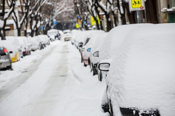snow-covered street and cars