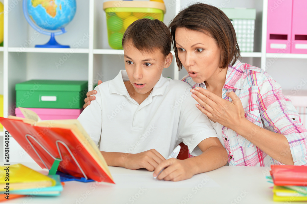 Canvas Prints emotional mother with her son doing homework