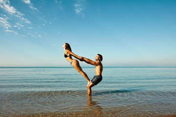 acro-yoga at beach