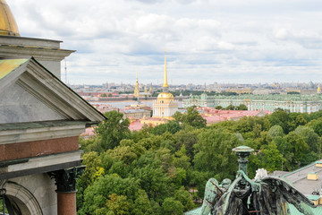 Fototapeta premium Rooftop view of the city of Saint Petersburg in Russia seen from the top of St. Isaac cathedral, chaotic urbanscape with some emerging monuments