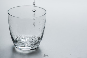 glass with water on a white background