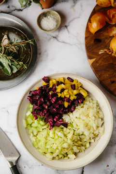 Preparation of a sofrito for a slow cooked dish.