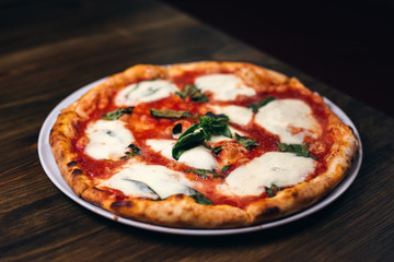 Pizza with mozzarella and black background