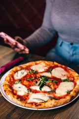 Pizza with mozzarella and black background