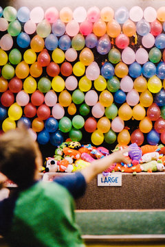 Boy Playing Dart Game