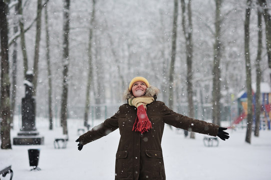 The woman in a snowy park