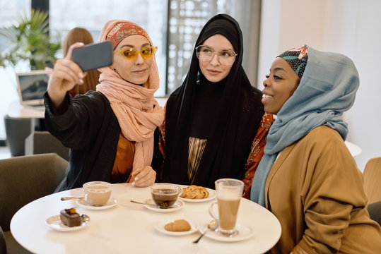 Contemporary Muslim Women Taking Selfie
