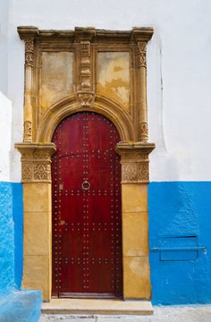 closed door of old building beside street,Rabat, Morocco.