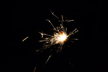 festive sparkler on black background