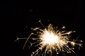 diwali or christmas sparkler lit in the night