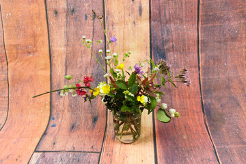Wild flowers on an old wooden background, autumn, nature, flowers