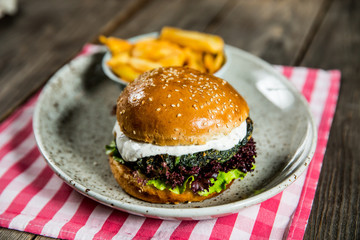 vegan burger with spinach and potatoes