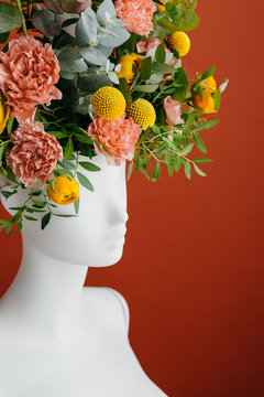Flowers inside a mannequin?s head.