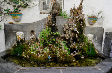 The colourful and interesting fountain with figures and scenes from Amalfi, Italy.