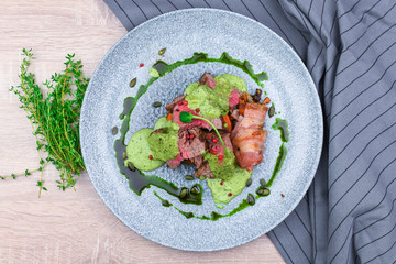 Steak with green sauce and pumpkin