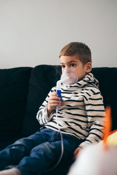 Kid holding inhaler