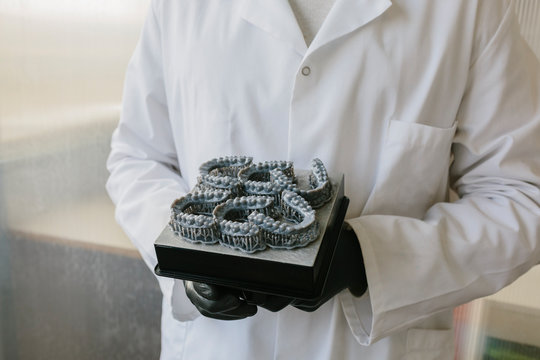 Orthodontists working in profesional dental lab