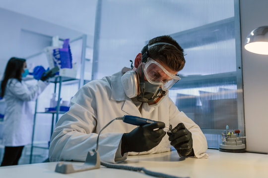 Orthodontists working in profesional dental lab