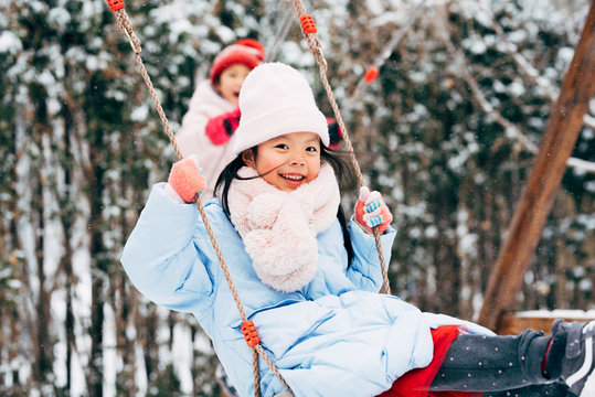 Cute girl playing in snow