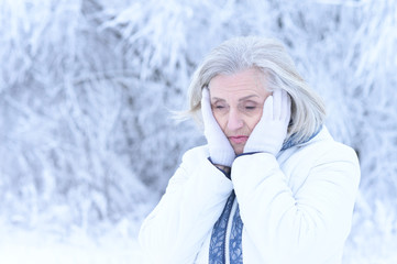 Close up portrait of sad beautiful senior woman