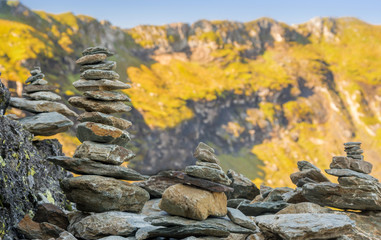Stack of stones on top of a mountain on mountains background. Concept of balance and harmony.