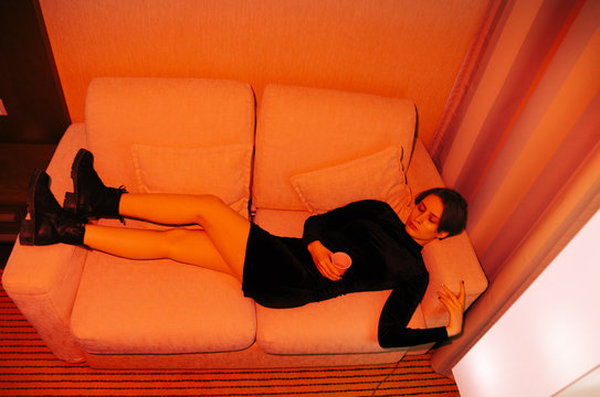 portrait of young androgyne woman on the bed