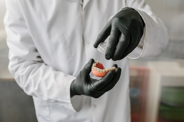 Orthodontists working in profesional dental lab
