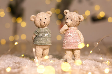 Decorative figurines of a Christmas theme. Figurines of cute teddy bears of a boy and a girl in...