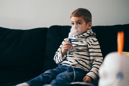 Kid holding inhaler