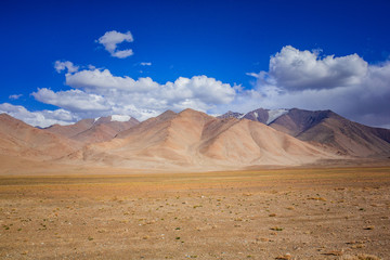 Fototapeta na wymiar Landscape view of dusty road going far away nowhere
