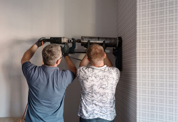 Men using heavy construction to drill hole