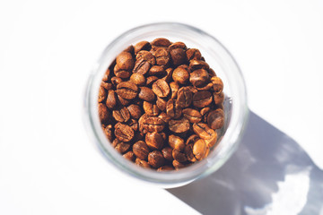 Large glass jar full of coffee beans.