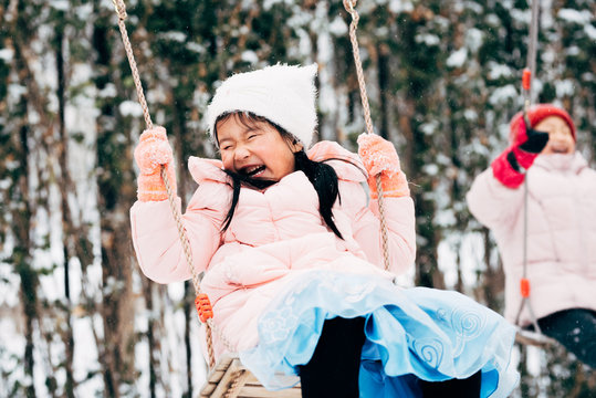 Cute girl playing in snow