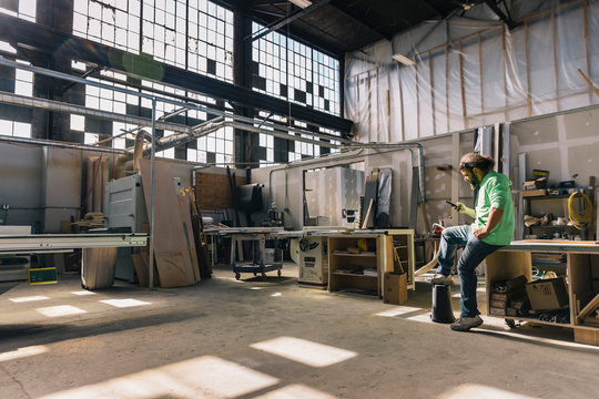 Hispanic Man using Cell Phone
