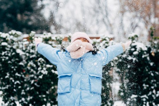 Cute girl playing in snow