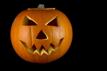 Halloween Carved Pumpkin on a Black Background