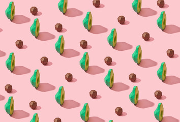 Creative diagonal pattern halves of avocado and bones of paper o