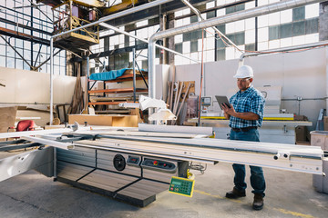 Confident Worker Using Tablet Computer